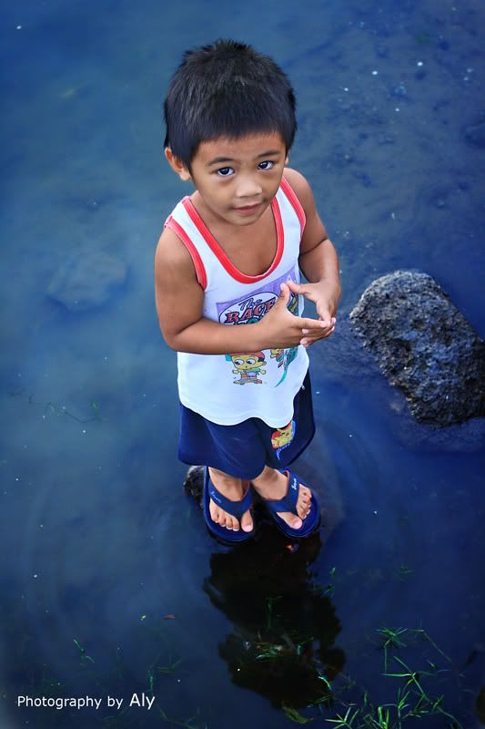 IMAGE: http://i161.photobucket.com/albums/t219/virtualaly/other%20side%20of%20alabang/w-boy-on-rock-3.jpg
